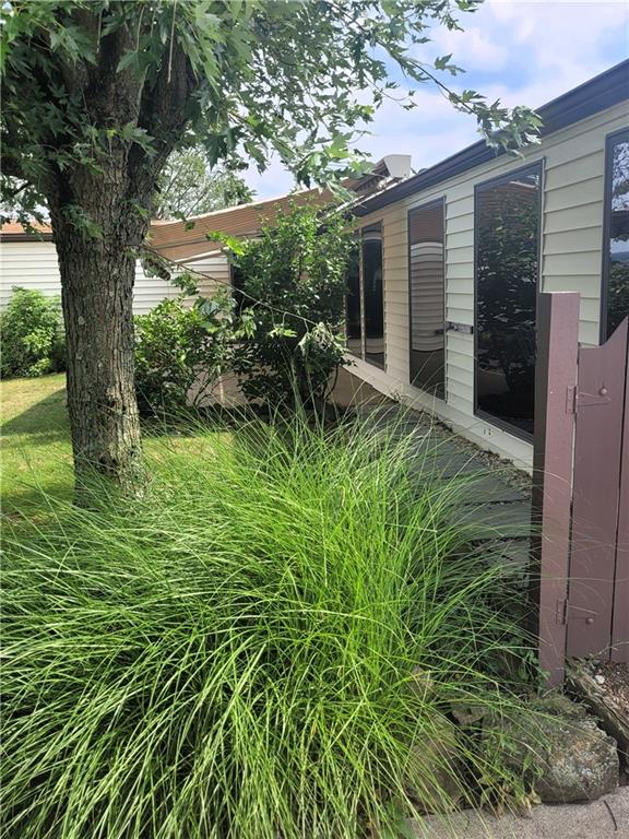735 Cardinal Lane Apollo, PA 15613 - Photo 19 of 20 a backyard of a house with plants and large tree