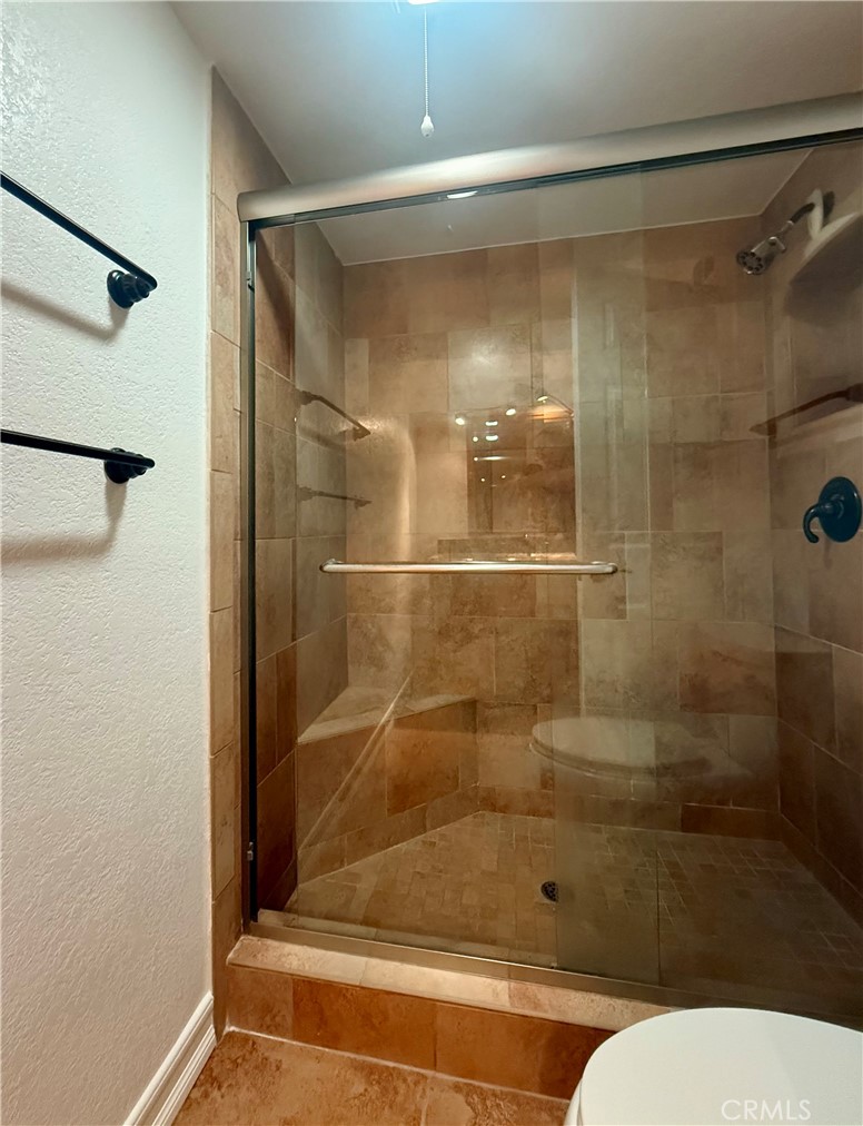 33665 Via Lagos Dana Point, CA 92629 - Photo 11 of 23 a bathroom with a shower and a toilet