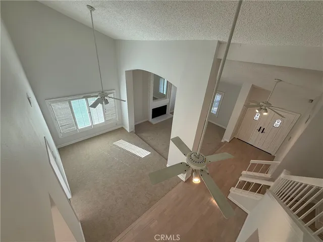 a living room with furniture and a book shelf