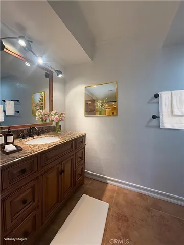 a bath room with a sink and a mirror