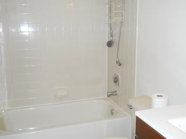 a bathroom with a sink vanity and a mirror