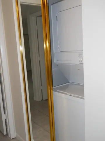 a kitchen with a sink a stove and cabinets