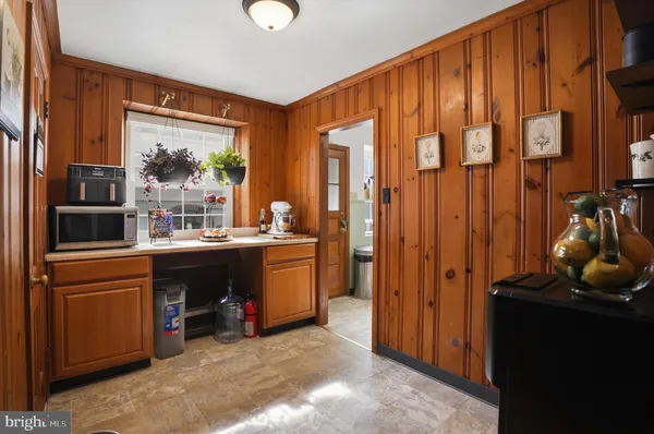 a room with a large window and storage