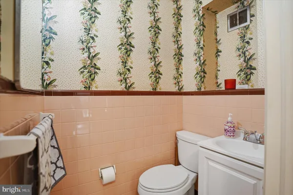 a bathroom with a toilet and a sink