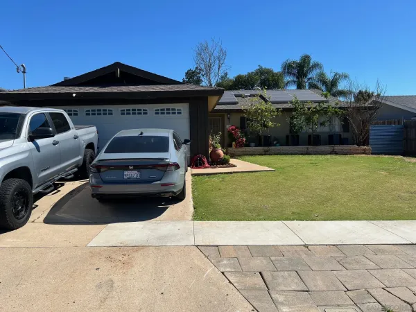 a car parked in front of a house
