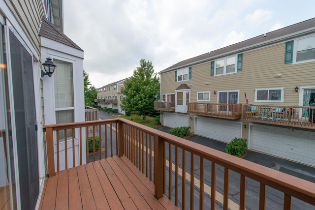 2422 Courtyard Circle, Unit 3 Aurora, IL 60506 - Photo 24 of 25 a view of a house with wooden deck