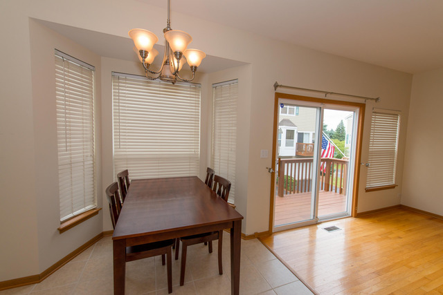 2422 Courtyard Circle, Unit 3 Aurora, IL 60506 - Photo 9 of 25 a dining room with furniture and window