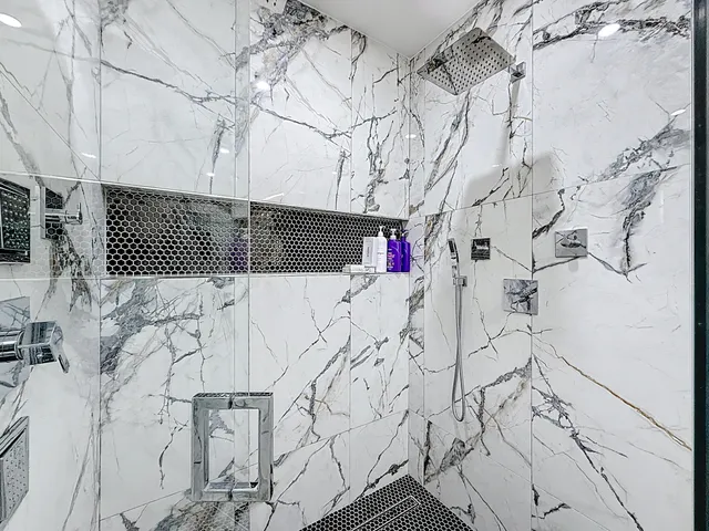 a view of a livingroom with furniture and a potted plant