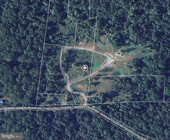 a aerial view of a house with a yard