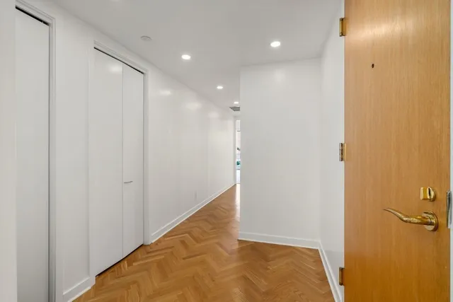 a view of a hallway with closet