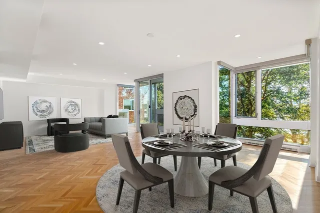 a view of a dining room with furniture window and outside view