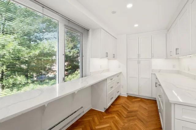 a bed room with a bed and a large window