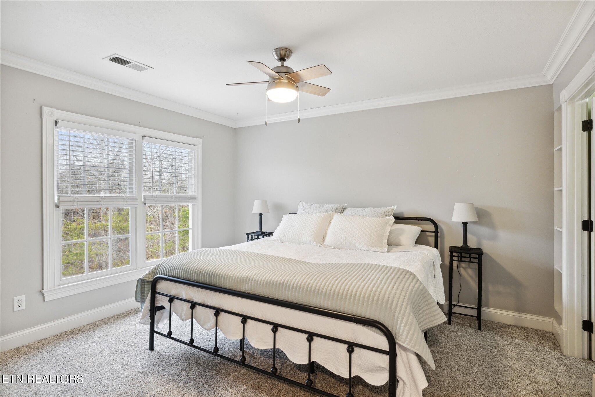 9245 Arlington Ridge Way Powell, TN 37849 - Photo 13 of 36 a bedroom with a bed and a large window