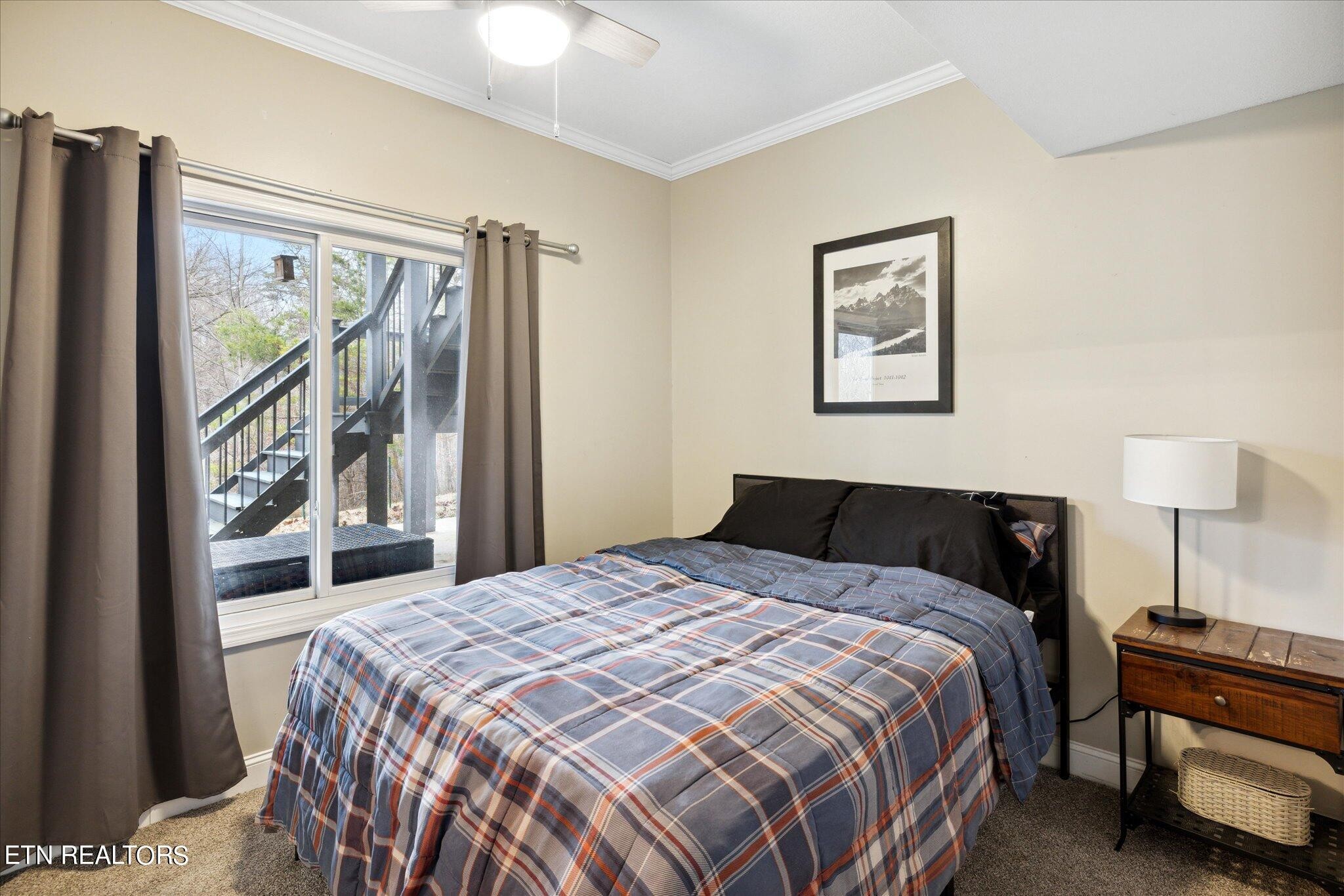 9245 Arlington Ridge Way Powell, TN 37849 - Photo 20 of 36 a bedroom with a bed and a painting on the wall