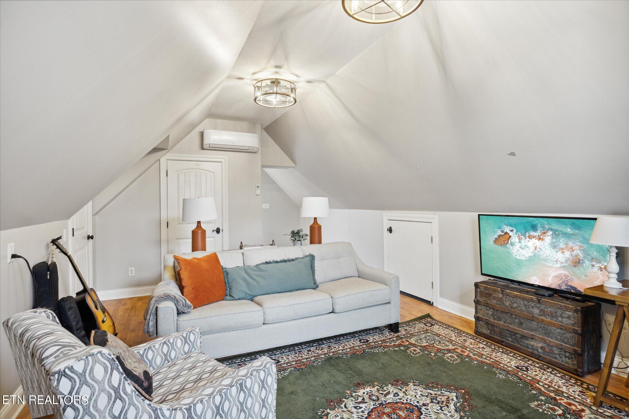 9245 Arlington Ridge Way Powell, TN 37849 - Photo 24 of 36 a living room with furniture and a flat screen tv