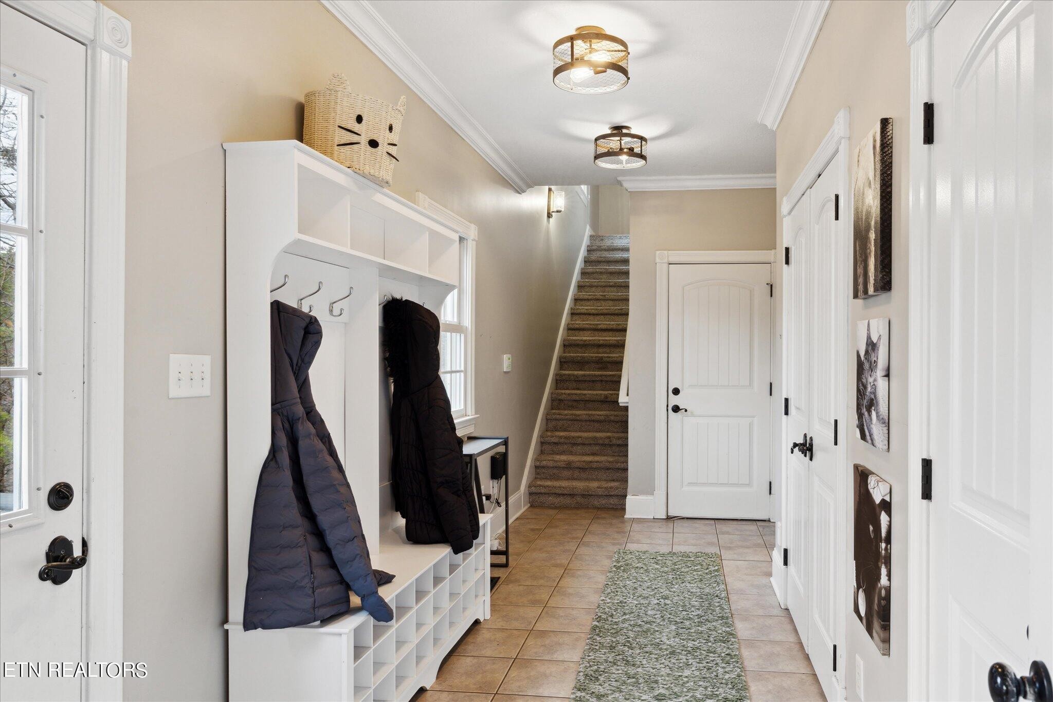 9245 Arlington Ridge Way Powell, TN 37849 - Photo 25 of 36 a view of a hallway with wooden floor and staircase