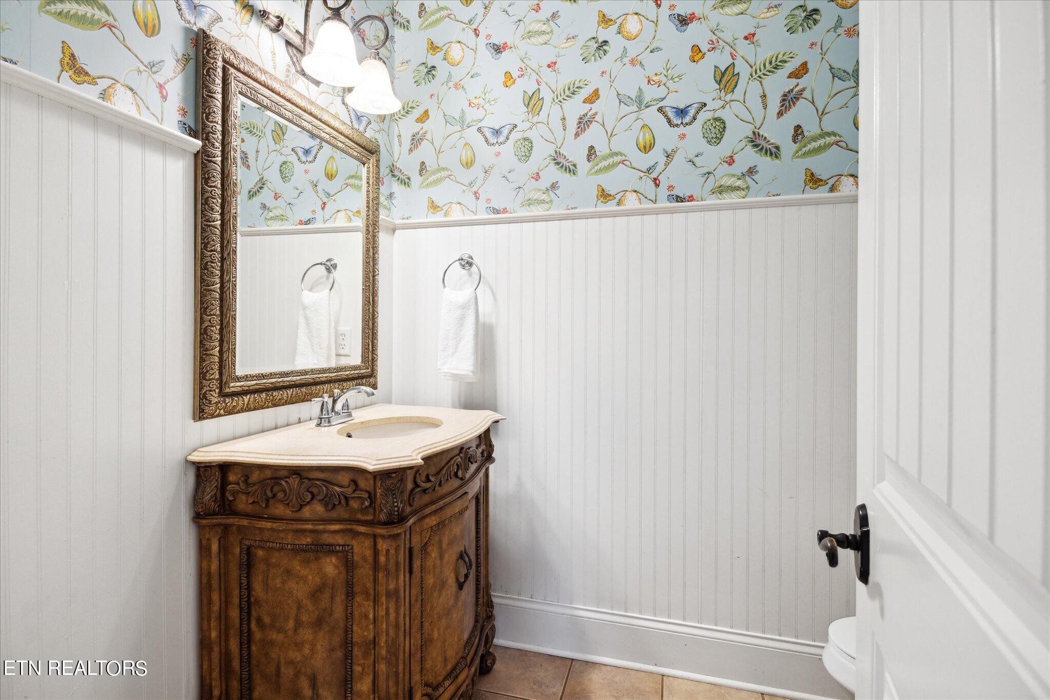 9245 Arlington Ridge Way Powell, TN 37849 - Photo 26 of 36 a bathroom with a sink and a mirror