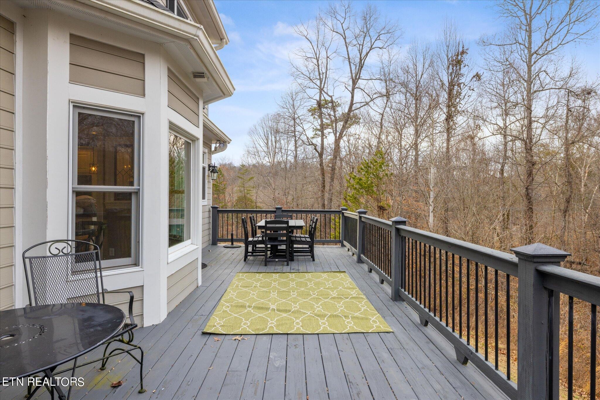9245 Arlington Ridge Way Powell, TN 37849 - Photo 29 of 36 a view of a chairs and table on the wooden floor