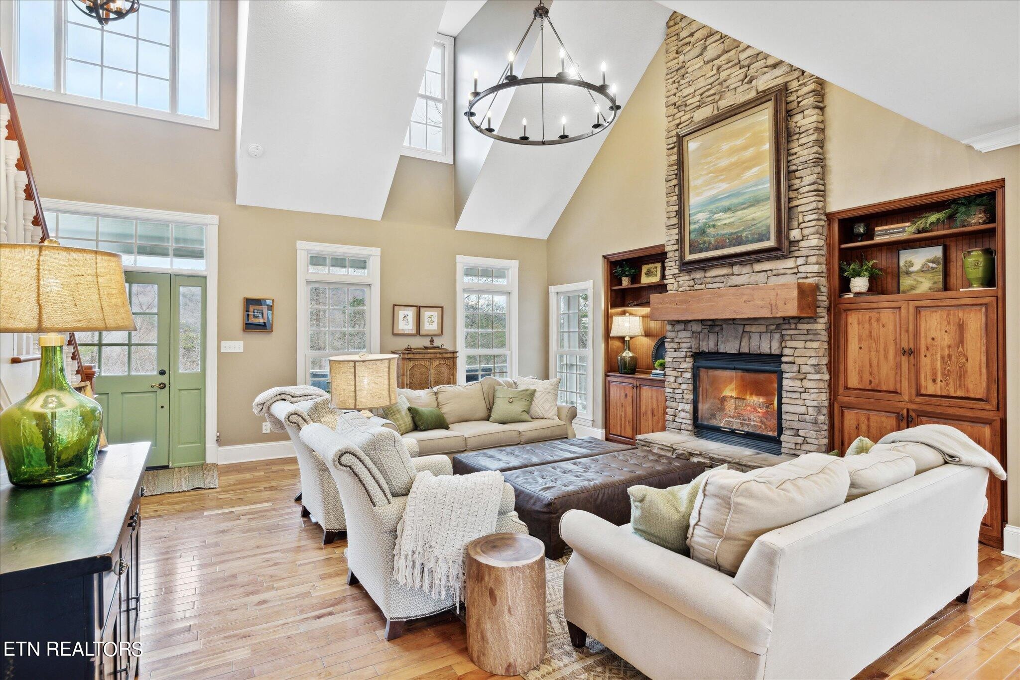 9245 Arlington Ridge Way Powell, TN 37849 - Photo 4 of 36 a living room with furniture wooden floor and a fireplace