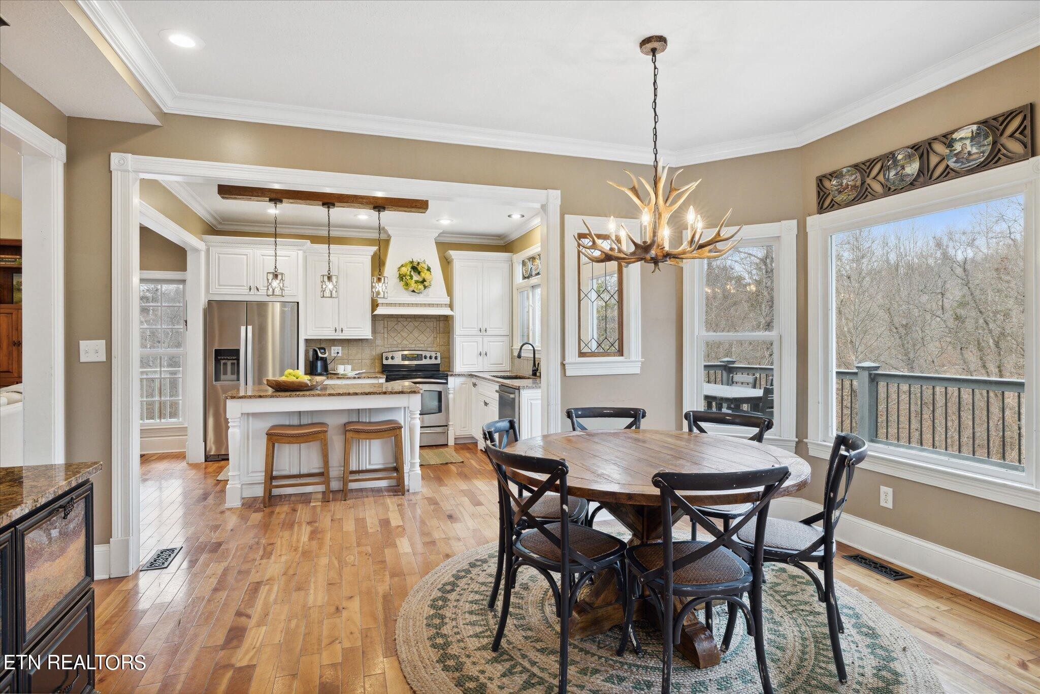 9245 Arlington Ridge Way Powell, TN 37849 - Photo 7 of 36 a view of a dining room with furniture window and wooden floor
