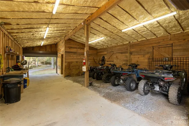a view of a garage with a bike and car