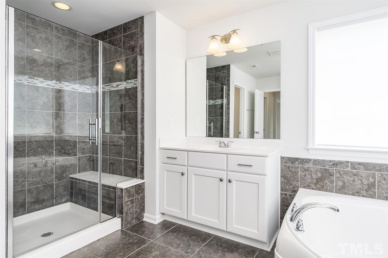 324 Morgan Ridge Road Holly Springs, NC 27540 - Photo 18 of 30 Modern tile throughout the Master bath with private commode.