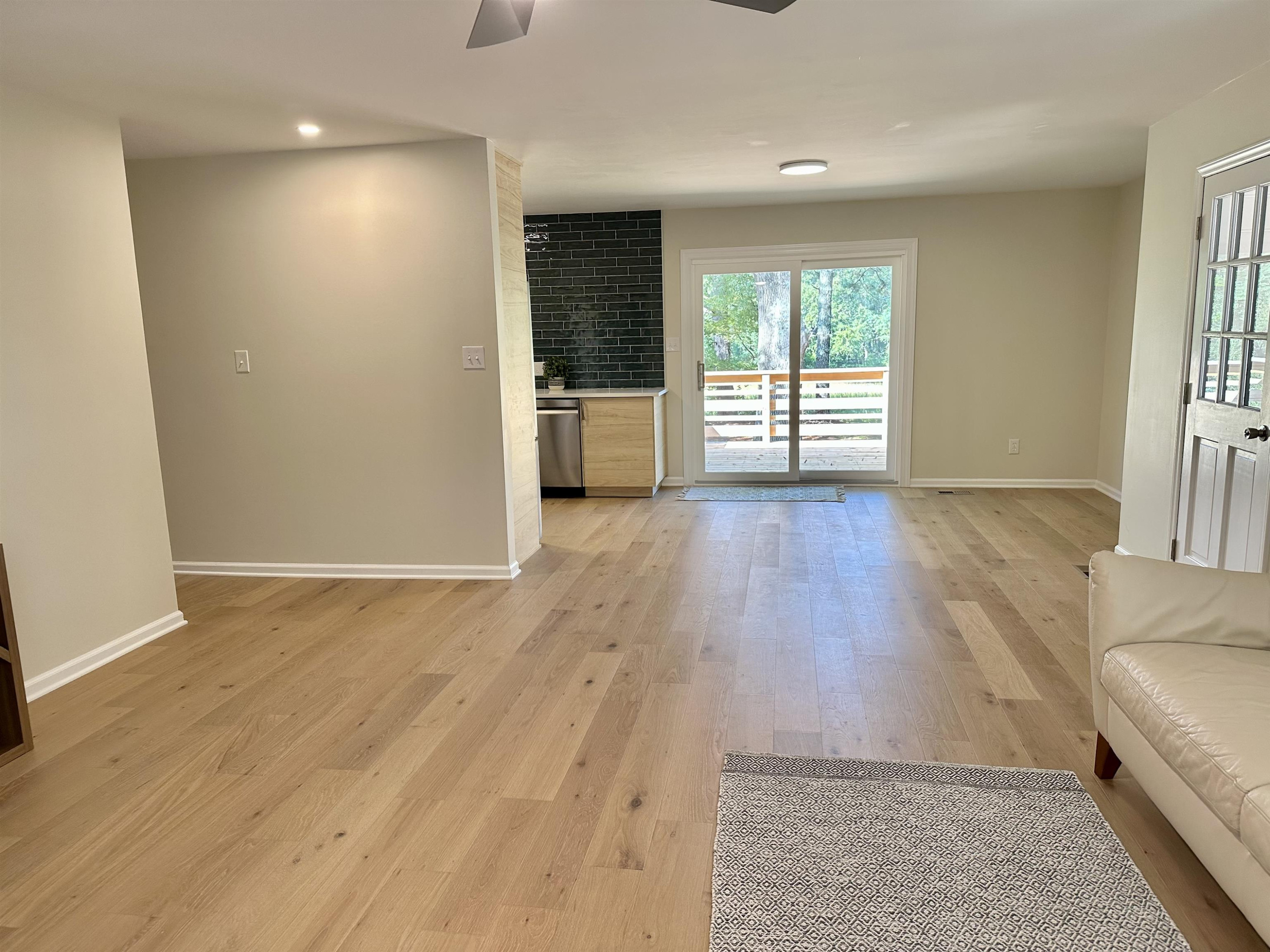 8904 Ransdell Road Raleigh, NC 27603 - Photo 11 of 23 an empty room with wooden floor and windows