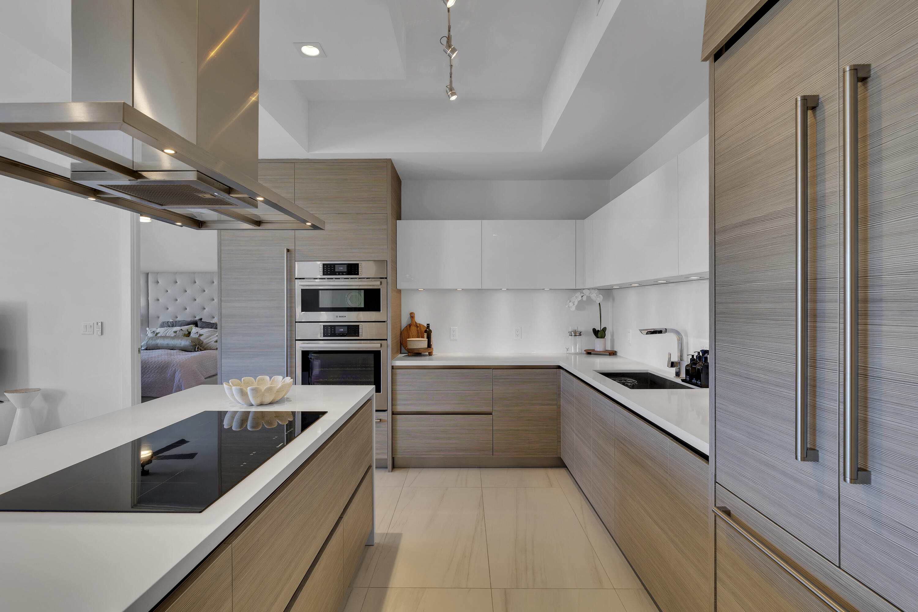 a kitchen with stainless steel appliances a sink a stove and cabinets