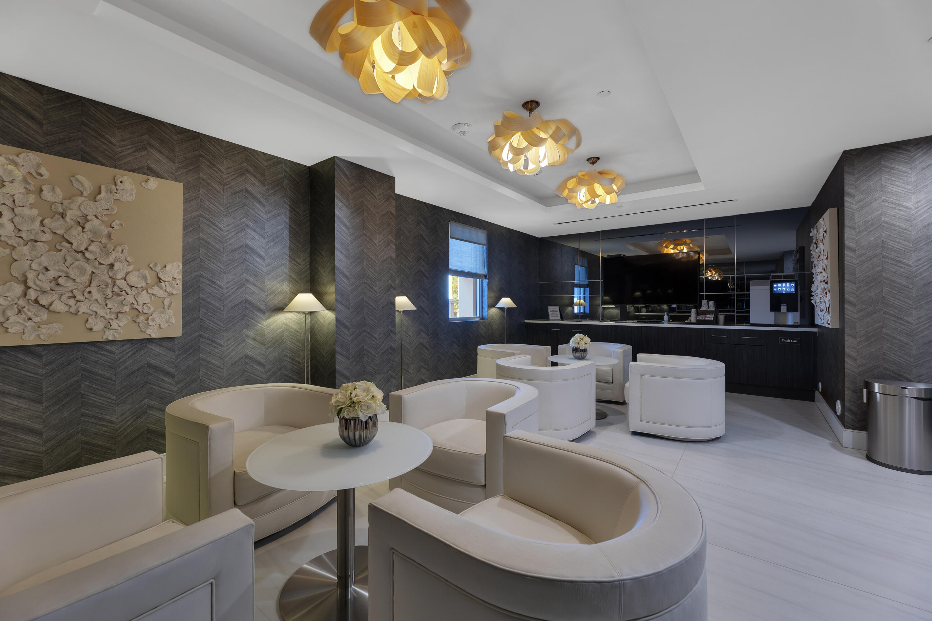 155 East Boca Raton Road, Unit 607 Boca Raton, FL 33432 - Photo 14 of 15 a kitchen with a dining table cabinets and a sink