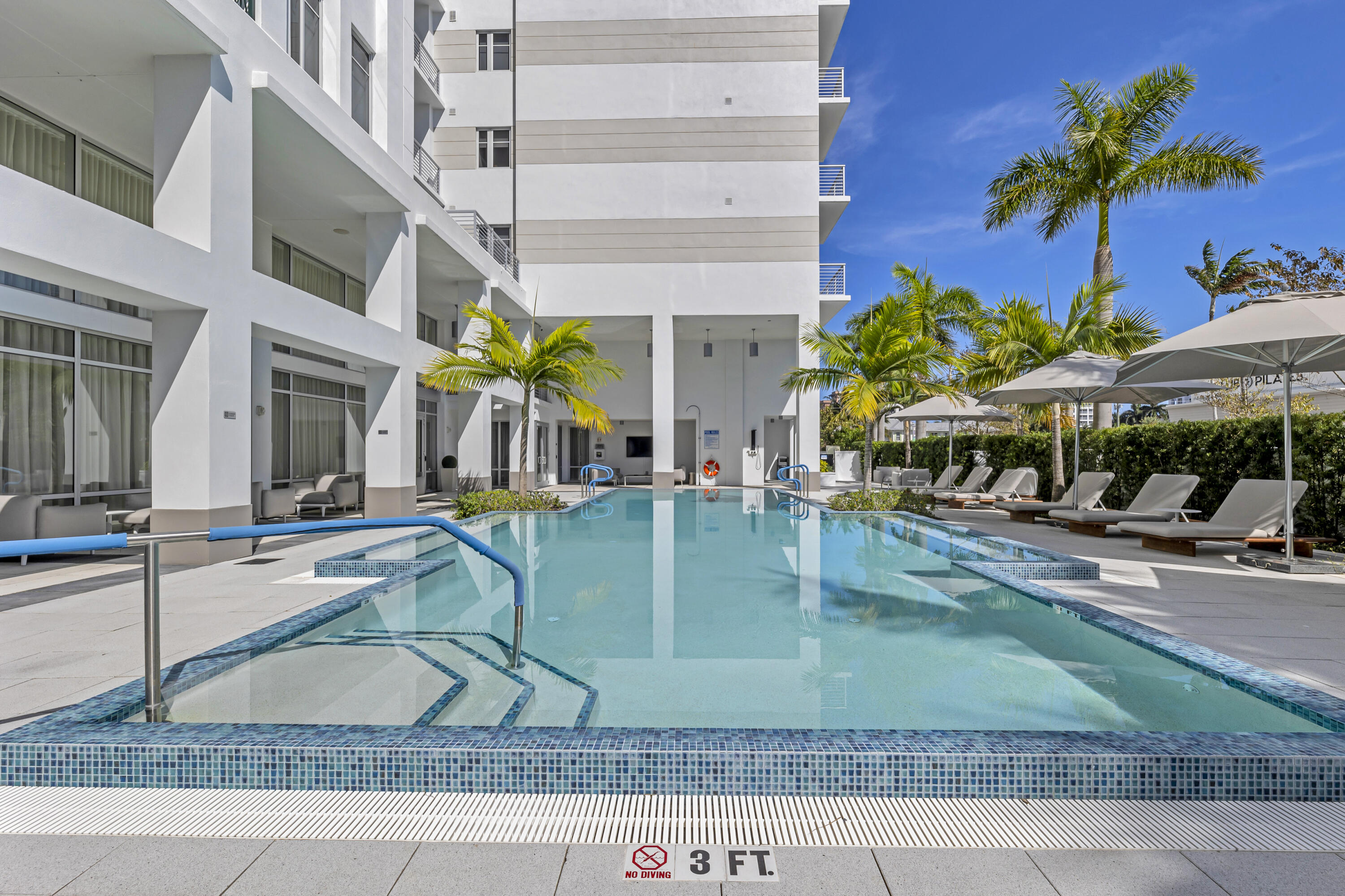 155 East Boca Raton Road, Unit 607 Boca Raton, FL 33432 - Photo 4 of 15 front view of a building with a yard