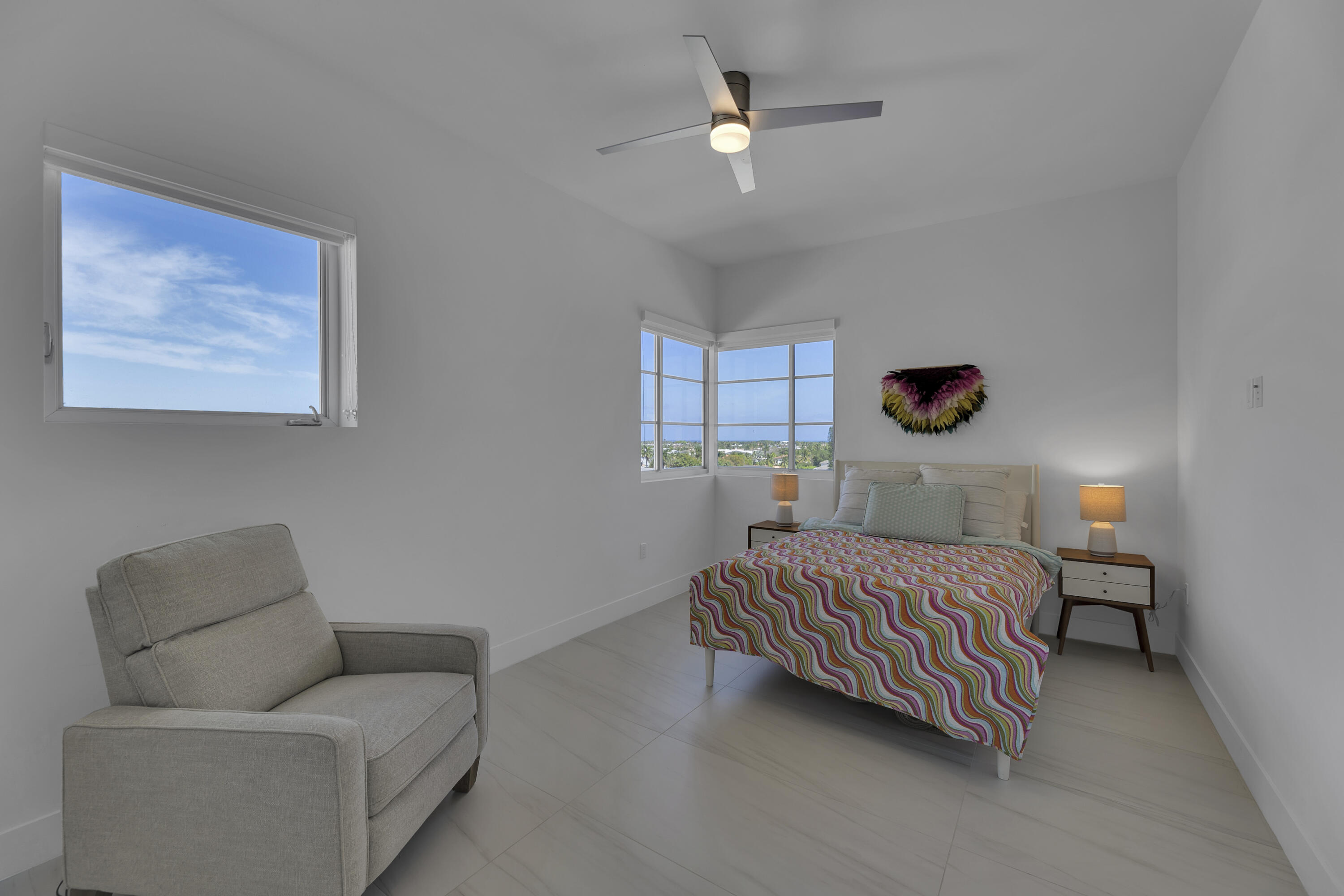 155 East Boca Raton Road, Unit 607 Boca Raton, FL 33432 - Photo 10 of 15 a bedroom with a bed couch and window