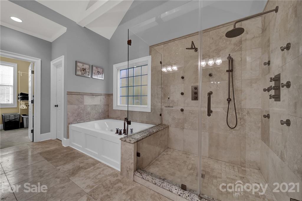 1804 Sam Smith Road Fort Mill, SC 29708 - Photo 33 of 48 a spacious bathroom with a tub shower and sink