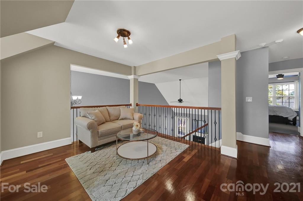 1804 Sam Smith Road Fort Mill, SC 29708 - Photo 36 of 48 a living room with furniture and a wooden floor