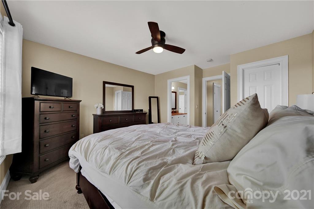 1804 Sam Smith Road Fort Mill, SC 29708 - Photo 40 of 48 a spacious bedroom with a bed and a flat screen tv