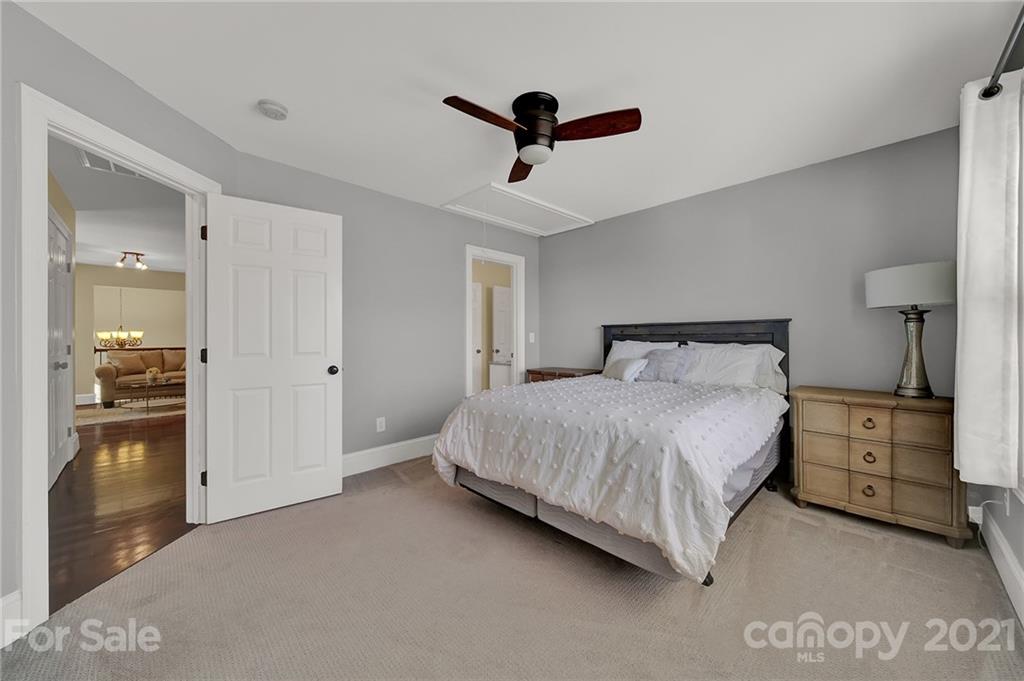 1804 Sam Smith Road Fort Mill, SC 29708 - Photo 41 of 48 a bedroom with a bed and cabinets