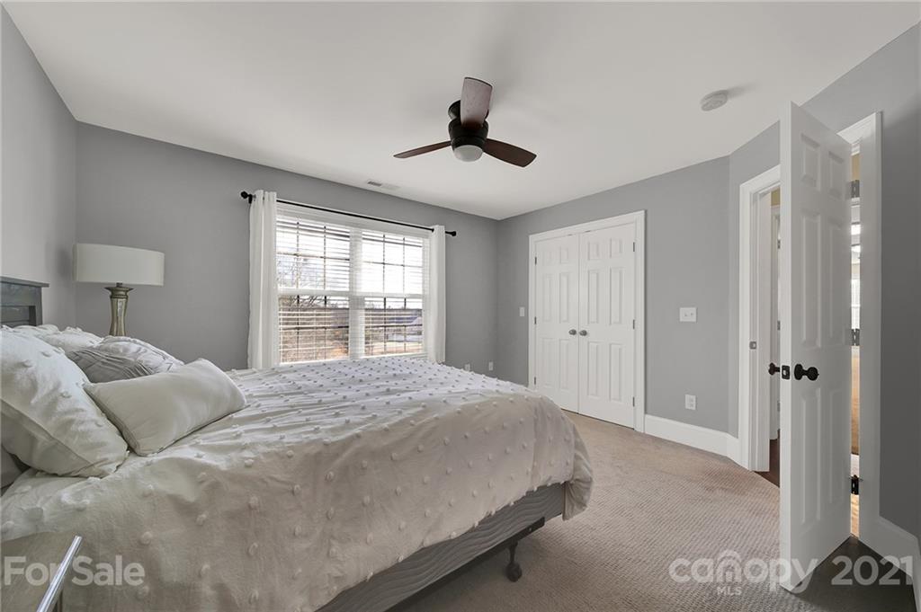 1804 Sam Smith Road Fort Mill, SC 29708 - Photo 42 of 48 a bedroom with a large bed and a window