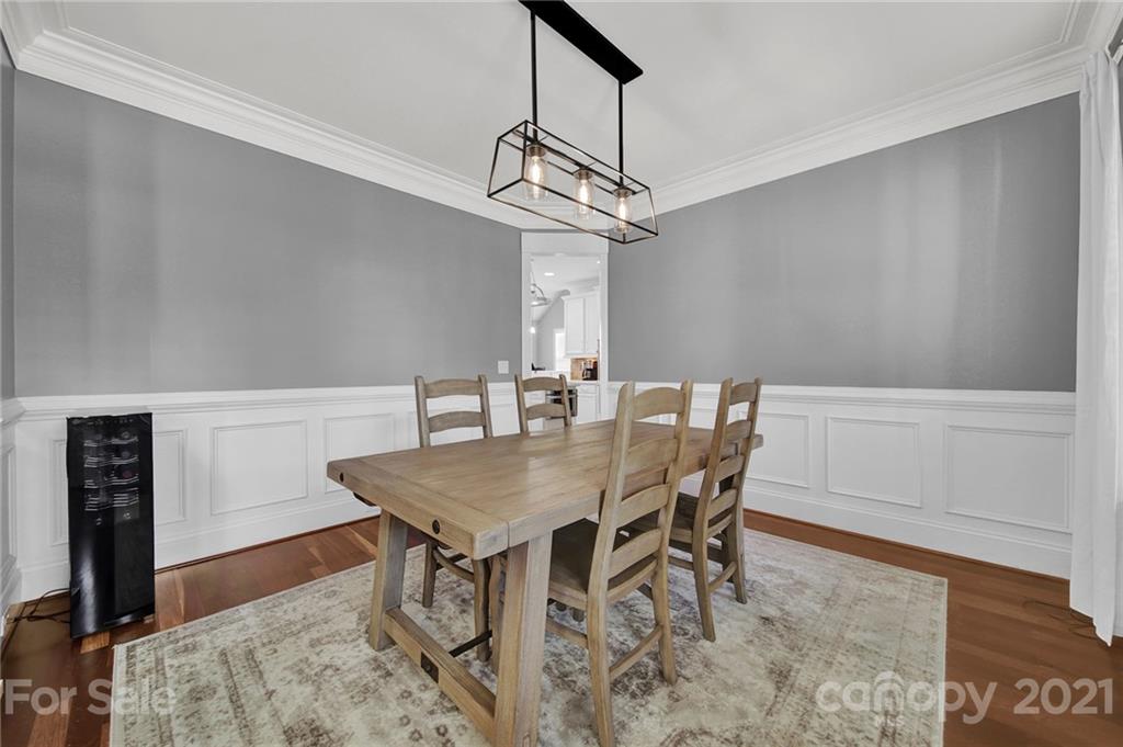 1804 Sam Smith Road Fort Mill, SC 29708 - Photo 8 of 48 a view of a dining room with furniture and wooden floor