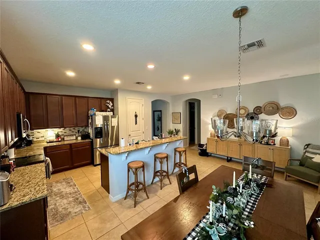 a room with lots of chairs and mirrors