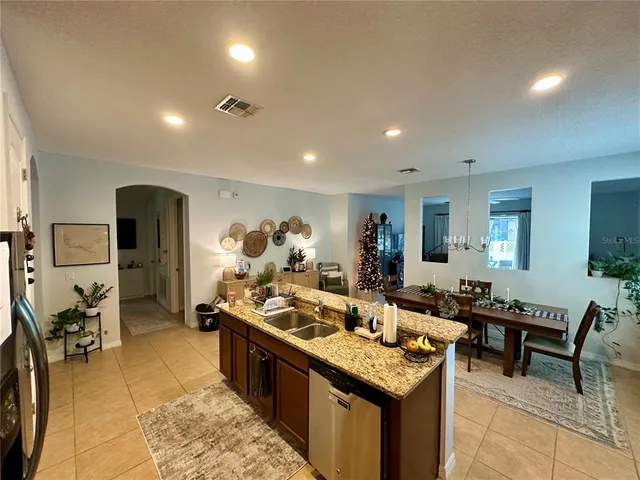a kitchen with a table and chairs in it