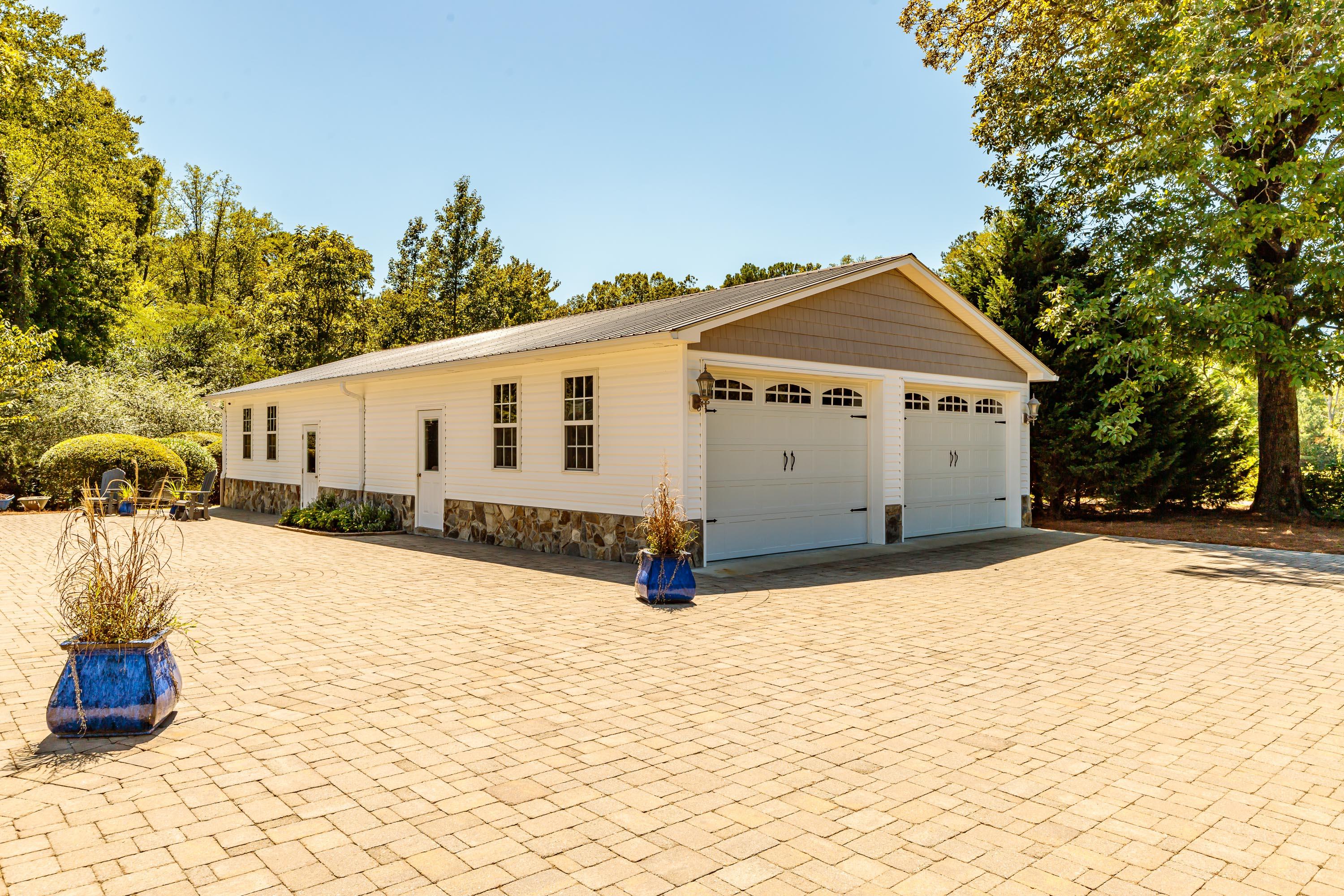 2777 Farm Life School Road Carthage, NC 28327 - Photo 3 of 44 Extra wide 2 car garage, workshop, full bath & an additional 700+sqft of heated/cooled living space.
