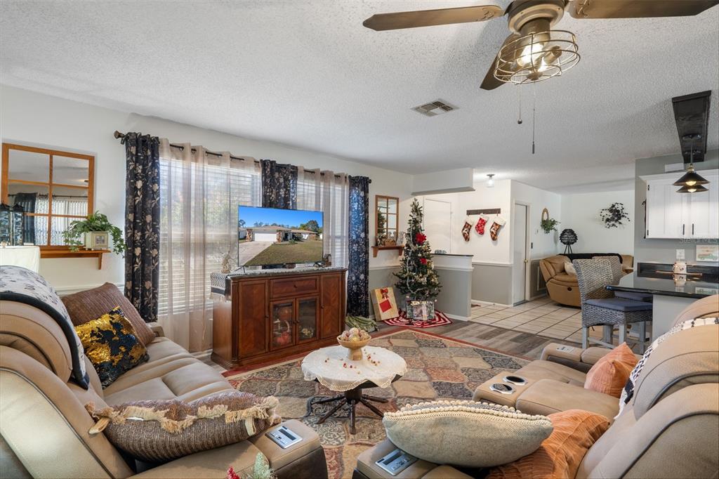 7311 Edinburgh Way Weeki Wachee, FL 34613 - Photo 11 of 27 a living room with furniture and a window