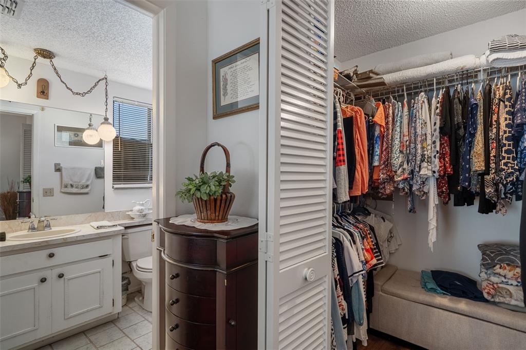 7311 Edinburgh Way Weeki Wachee, FL 34613 - Photo 15 of 27 a bathroom with a sink a mirror and shower