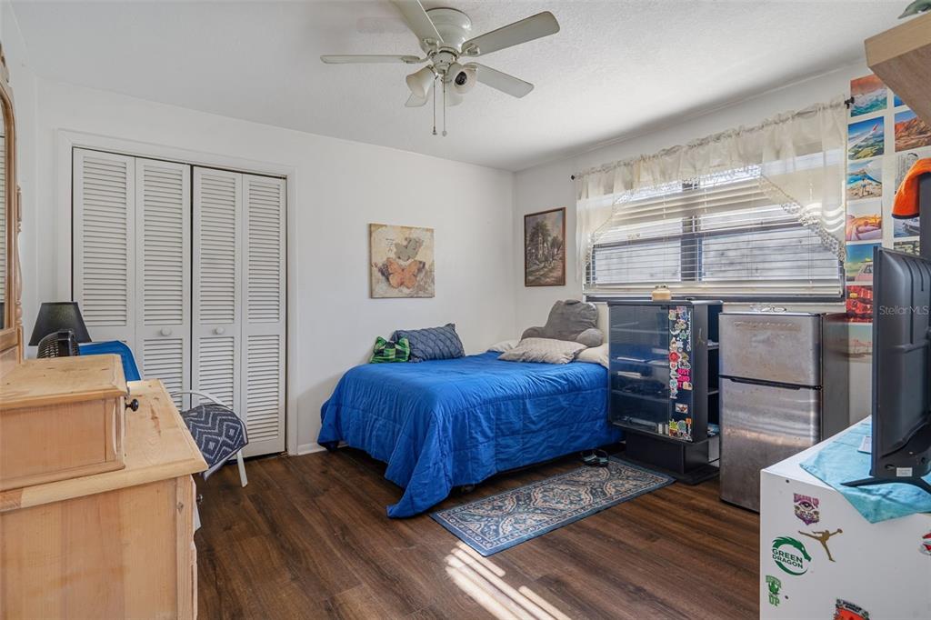 7311 Edinburgh Way Weeki Wachee, FL 34613 - Photo 17 of 27 a bedroom with a bed and a window