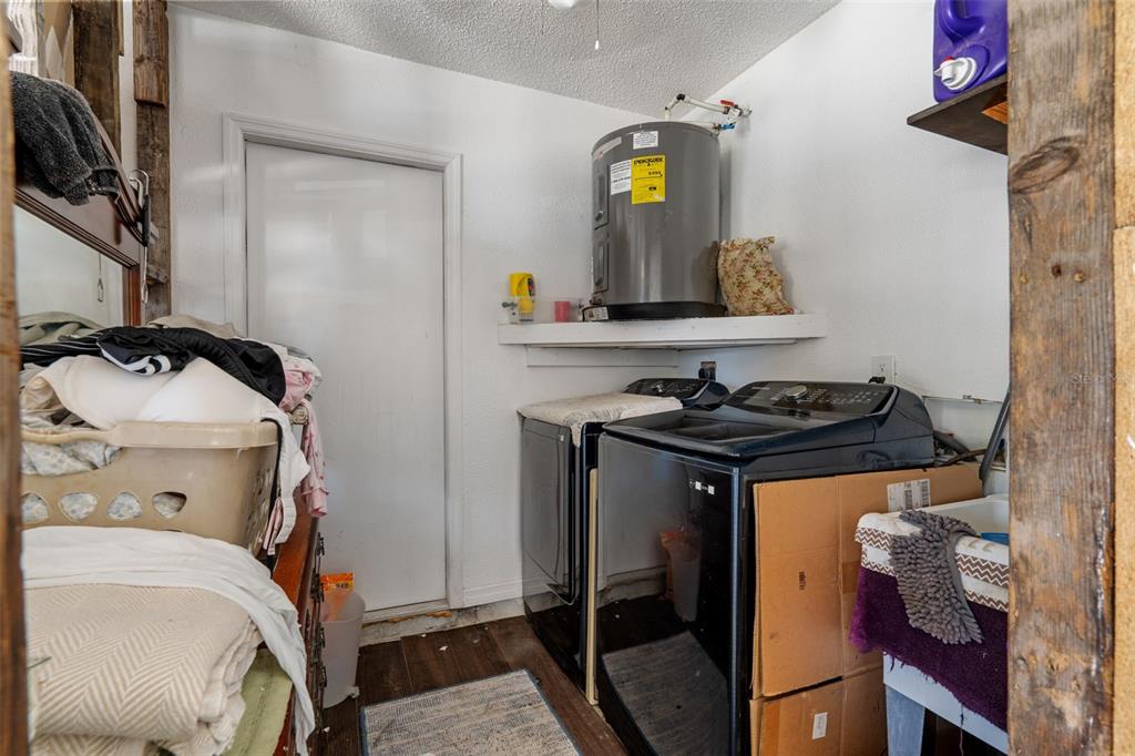 7311 Edinburgh Way Weeki Wachee, FL 34613 - Photo 20 of 27 a view of storage and utility room
