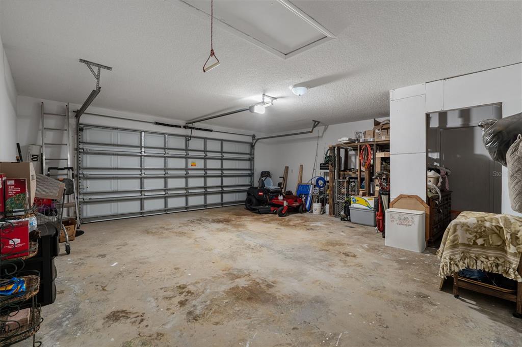 7311 Edinburgh Way Weeki Wachee, FL 34613 - Photo 21 of 27 a view of a garage with storage