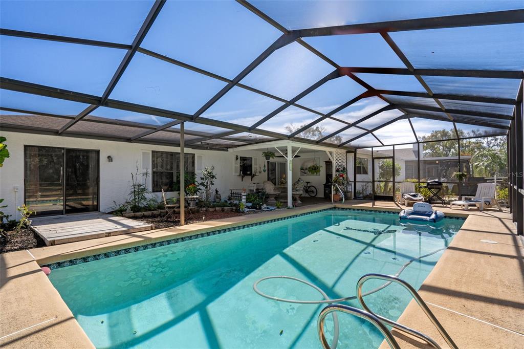 7311 Edinburgh Way Weeki Wachee, FL 34613 - Photo 23 of 27 a view of a swimming pool with a patio