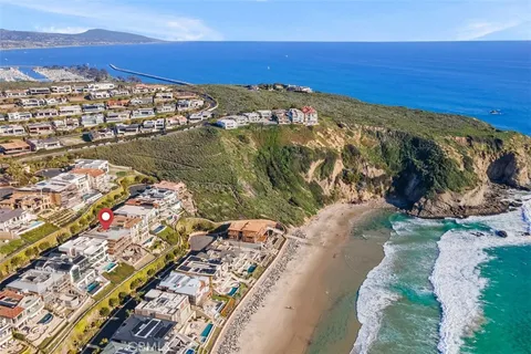 a view of an ocean with a building in the background