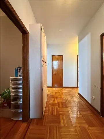 a view of front door with wooden floor