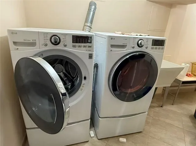 a utility room with dryer and washer