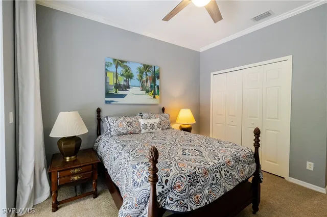 a bedroom with a bed and a lamp on table